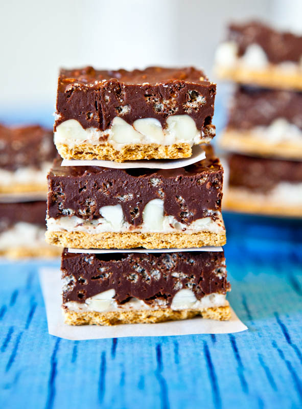 Stacked Peanut Butter Cocoa Krispies Smores Bars on parchment paper