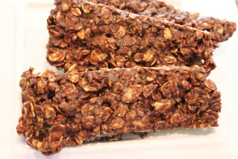 Three Microwave Chocolate Peanut Butter & Oat Bars on white plate