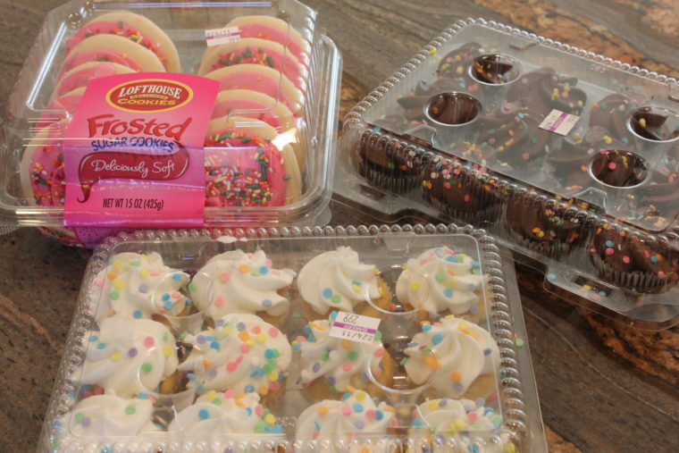 Packages of cookies a mini cupcakes