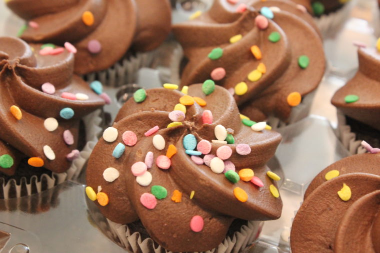Close up of mini chocolate cupcakes with sprinkles