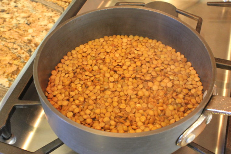 Lentils cooking in pot of water