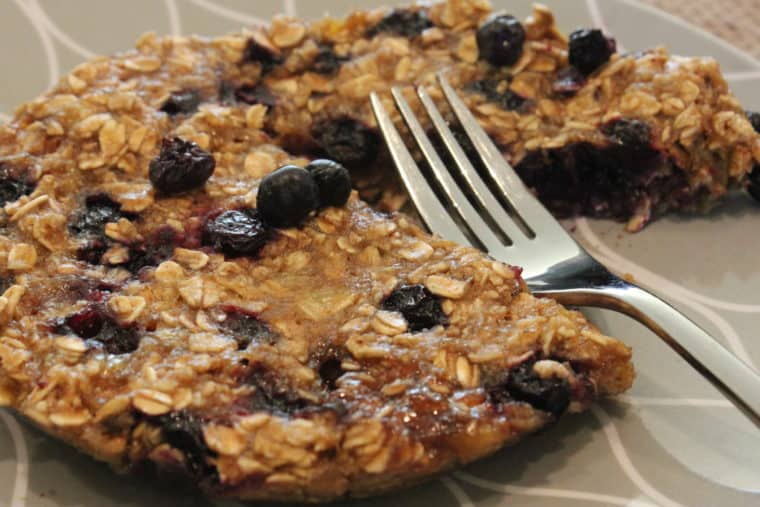 Microwave Blueberry Banana Oat Cake on plate with fork