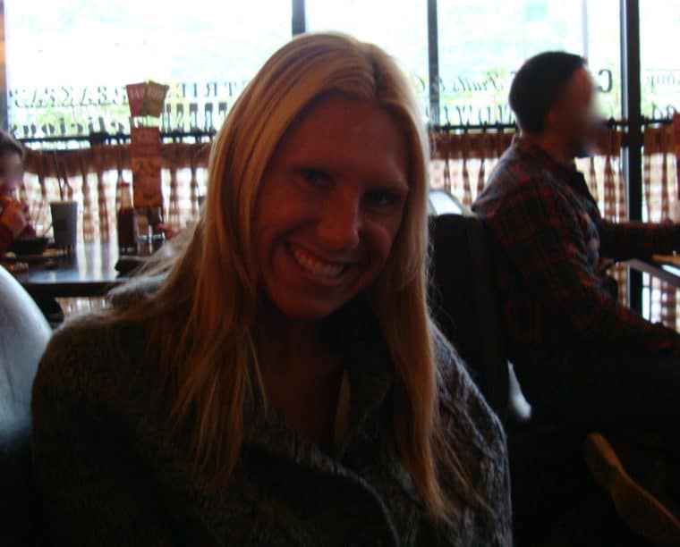 Woman smiling sitting at restaurant 