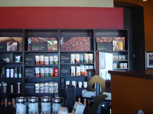 Inside Starbucks showing shelves full of coffee