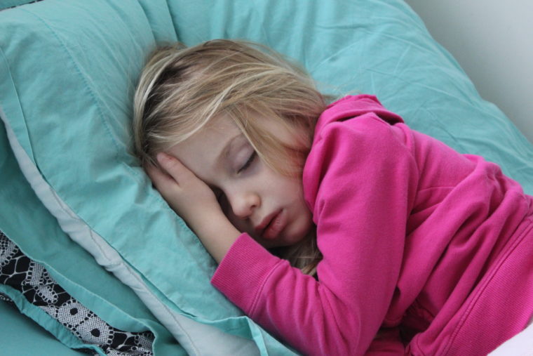 Young girl in bed sleeping