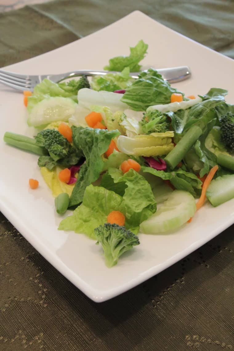 Salad with mixed vegetables on plate