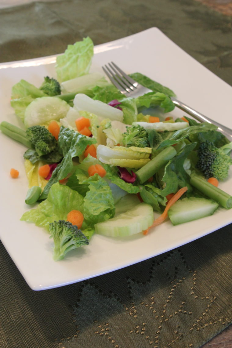 Close up of salad on plate with vegetables