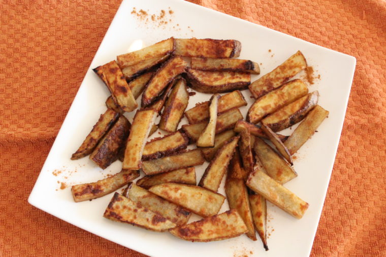 Overhead of finished Cinnamon-Sugar and Ginger-Roasted Potato Sticks