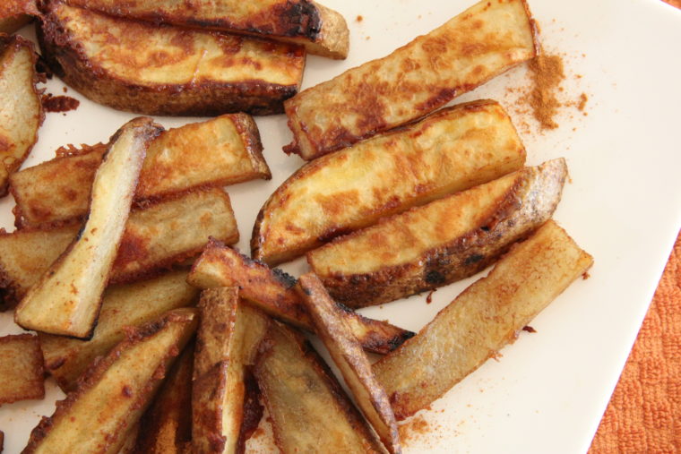 Close up of Cinnamon-Sugar and Ginger-Roasted Potato Sticks