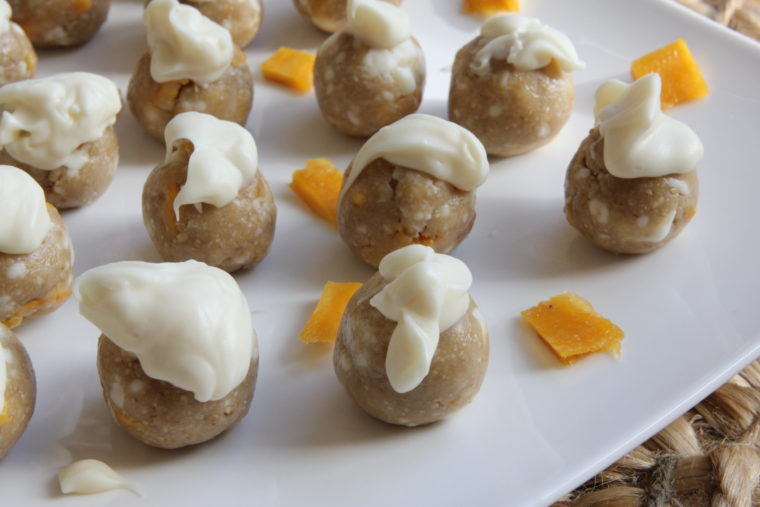 Close up of frosted No-Bake White Chocolate & Mango Cookie Dough Bites