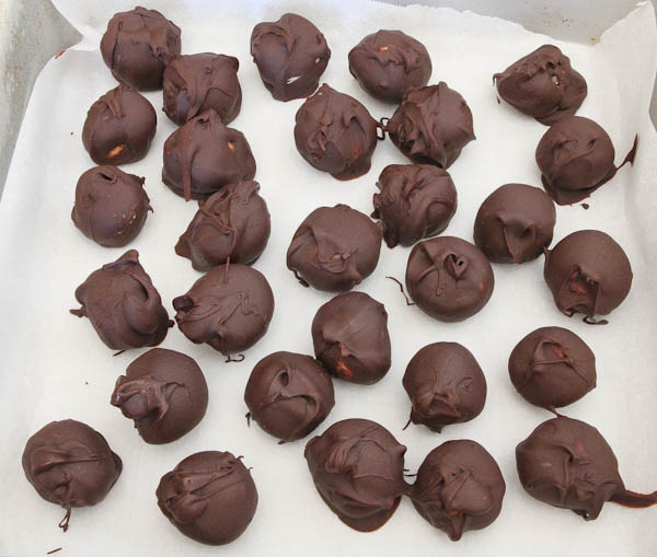 Balls dipped in melted chocolate and placed in freezer
