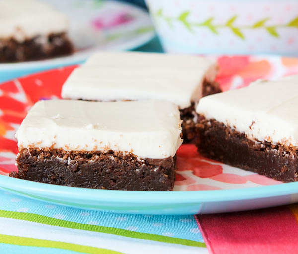 Fudgy Nutella Brownies with Cream Cheese Frosting on floral plate