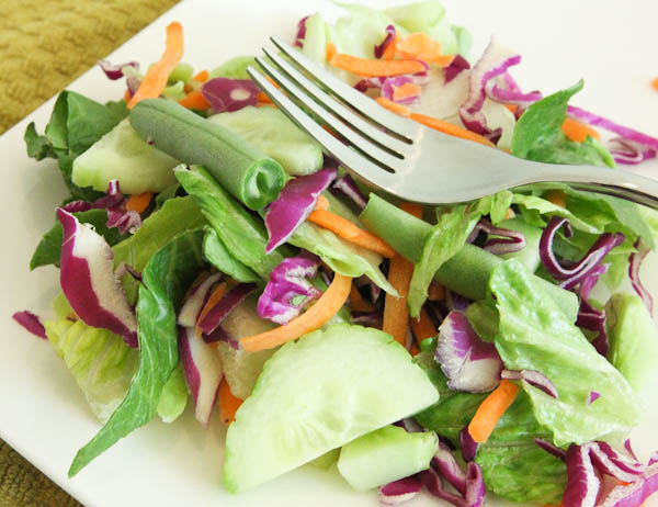 Salad with snap peas, carrots, and cucumbers