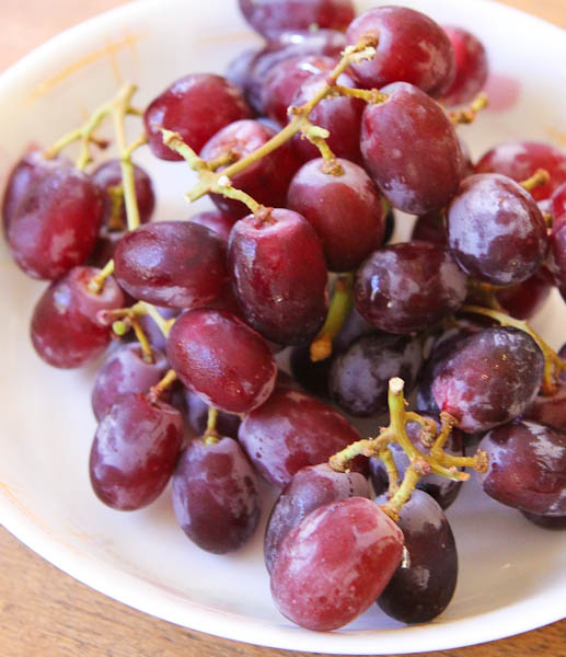 red grapes on plate