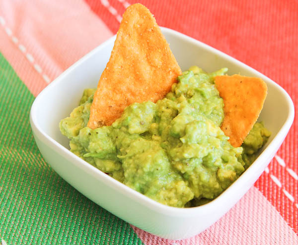 Guacamole in bowl with chips