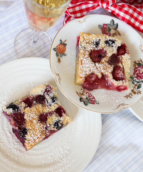 Overhead of two plates of sliced Mixed Berry Clafoutis