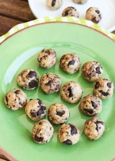 A plate of raw chocolate chip cookie dough balls.