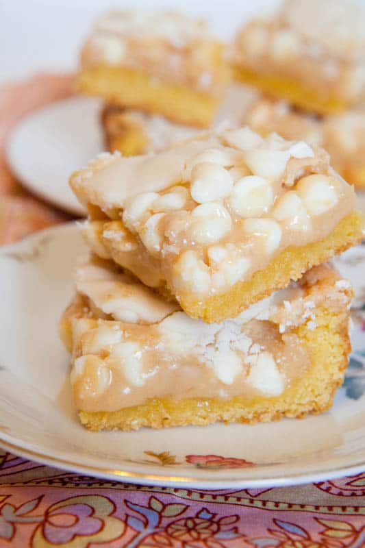 Two stacked White Chocolate Vanilla Marshmallow Cake Bars on plate