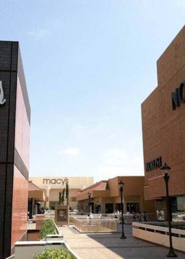 Outdoor shopping center with neiman marcus and nordstrom stores.