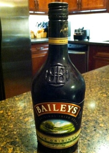 A bottle of baileys irish cream on a kitchen counter.