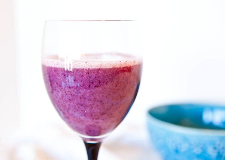Blueberry Banana Recovery Smoothie in wine glass