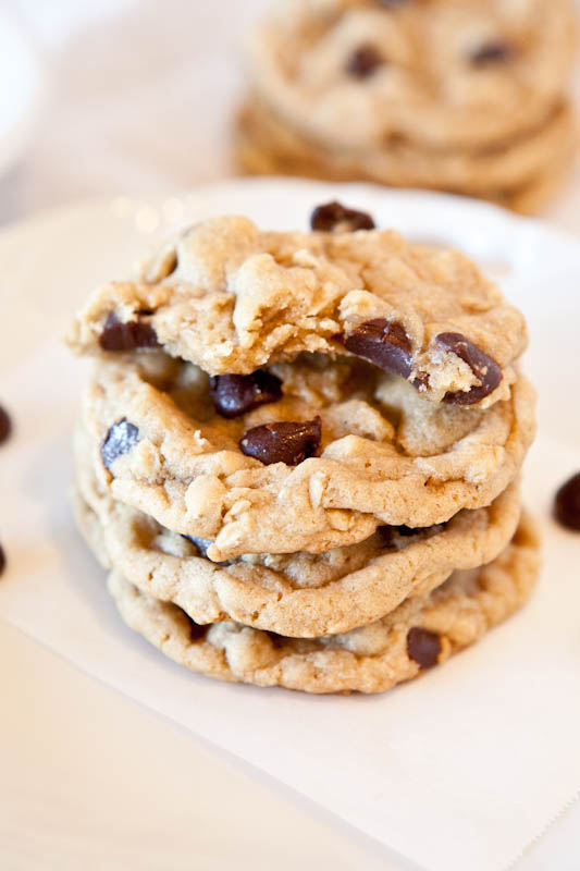 Stacked Chocolate Chip Peanut Butter Oatmeal Cookies on white plate