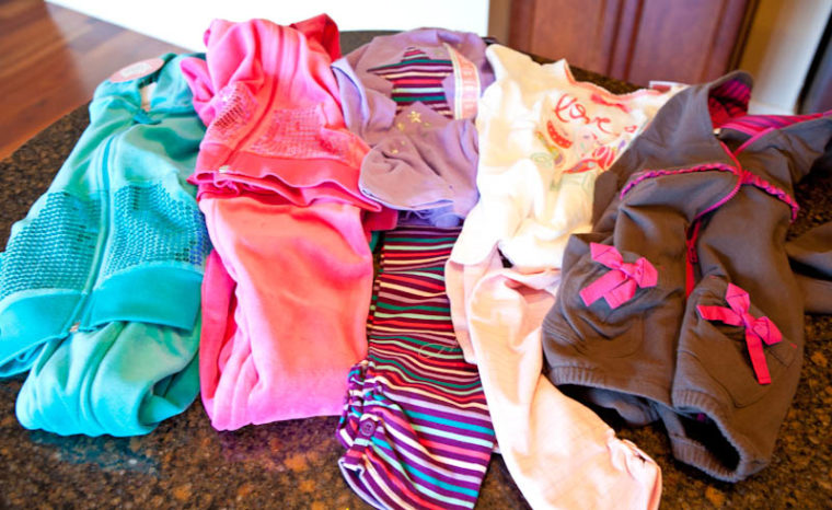 Sets of pink, blue, purple, and white clothes