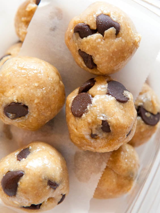 Raw Vegan Cookie Dough balls stacked with paper 