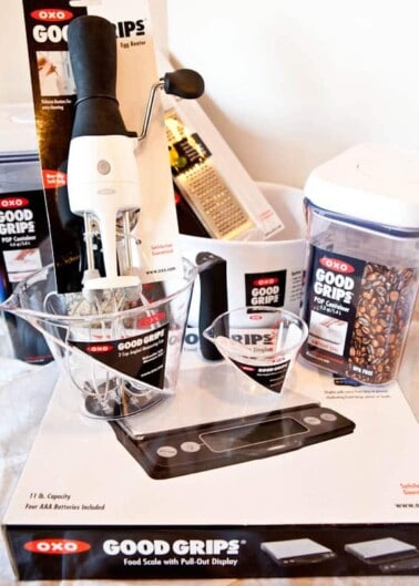 A collection of oxo good grips kitchenware and utensils displayed on a countertop.