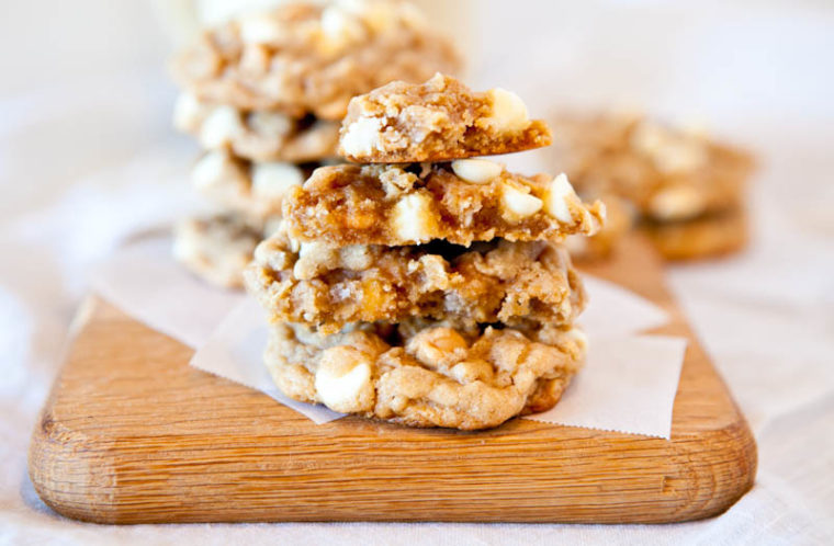 Soft and Chewy Peanut Butter Oatmeal White Chocolate Cookies stacked in half