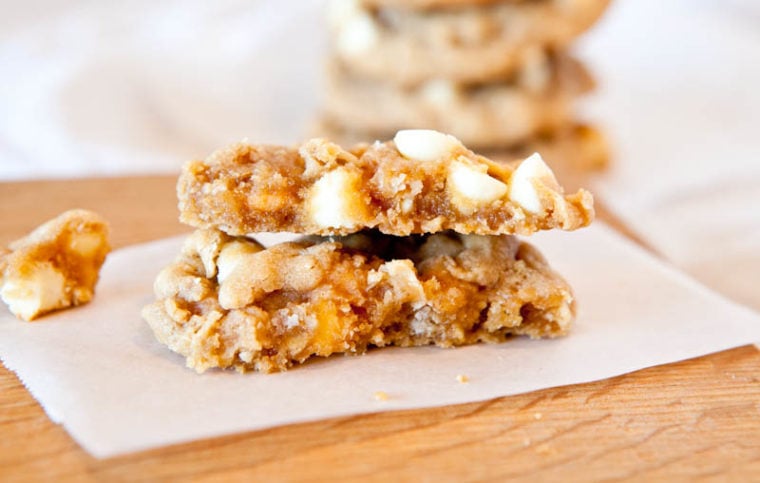 Soft and Chewy Peanut Butter Oatmeal White Chocolate Cookies stacked in half