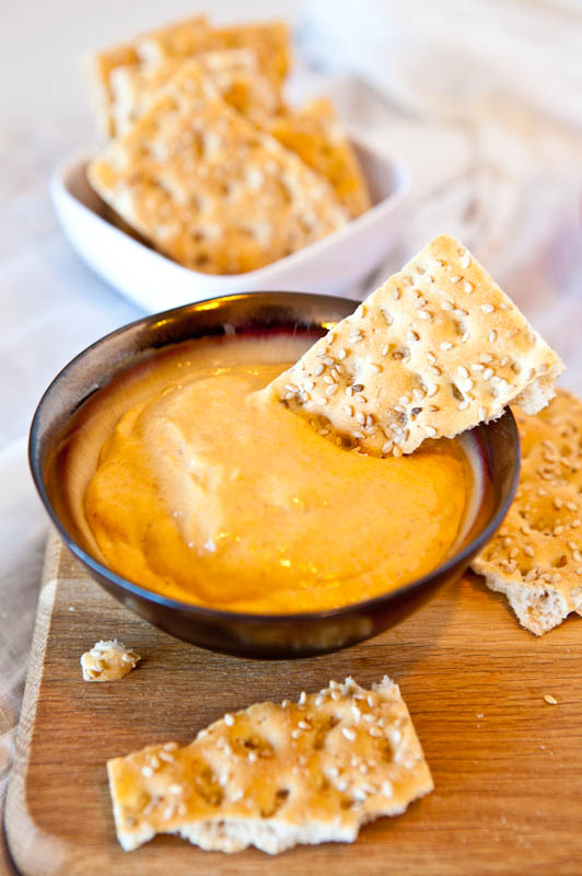 Caramel Pumpkin Whip Dip with crackers dipped in