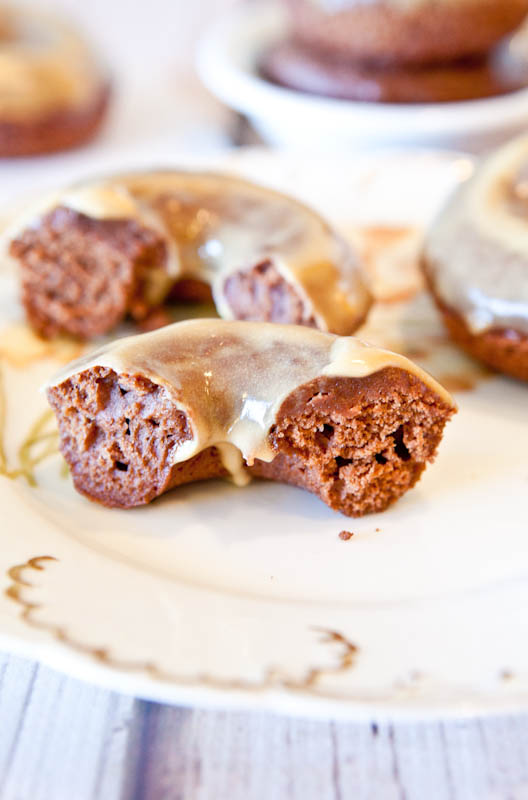 Baked Chocolate Peanut Butter Donuts with Vanilla Peanut Butter Glaze in half
