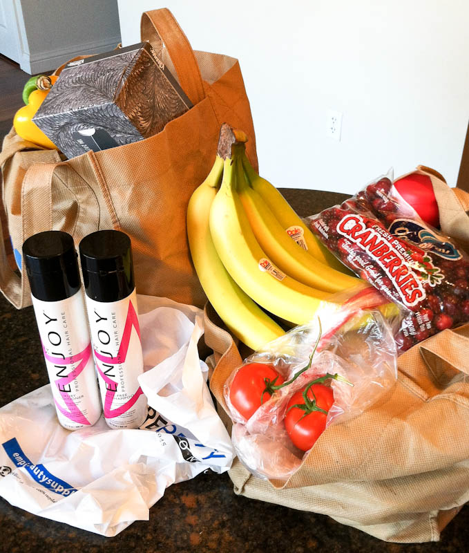 Grocery haul with fruits, tissues, and other products