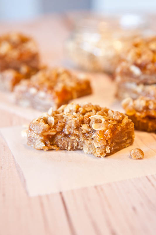 Caramel Peanut Butter & Jelly Bars with bite taken out of it