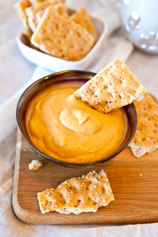 Caramel Pumpkin Whip Dip with crackers dipped in