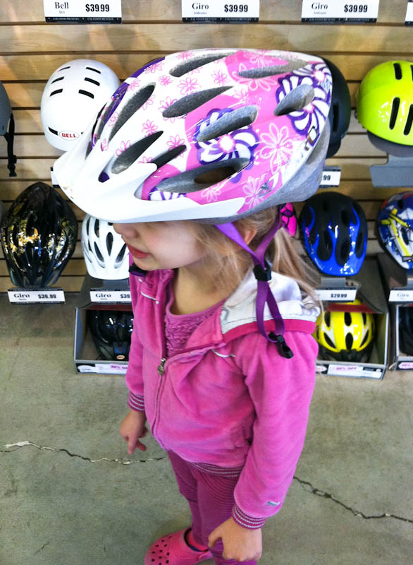 Skylar in white bike helmet with pink accents and flowers