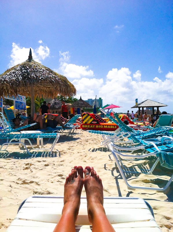 Aruba beach sand with beach chairs and umbrellas