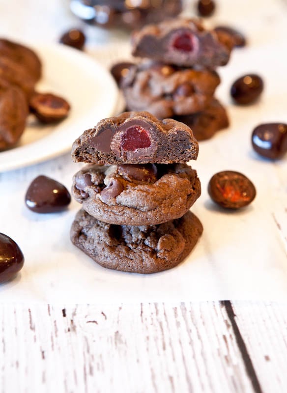 Stacked Dark Chocolate Chocolate-Chip Cookies Stuffed with Chocolate Covered Strawberries with one cut in half