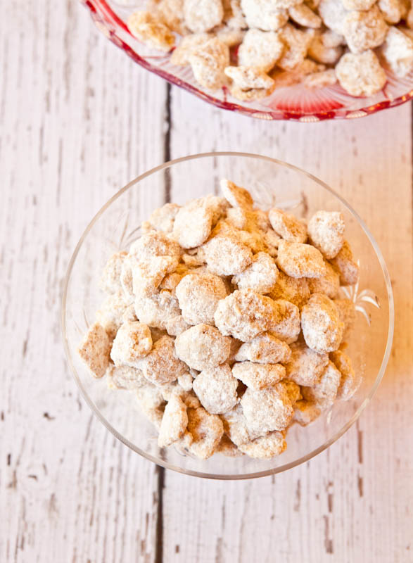 Overhead shot of White Chocolate Peanut Butter Puppy Chow on wooden table