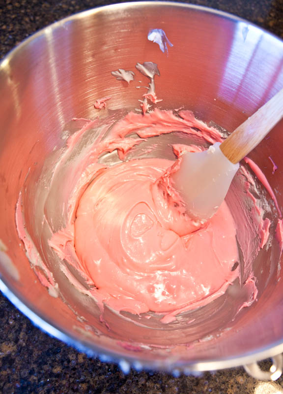 Bowl of pink cream cheese frosting