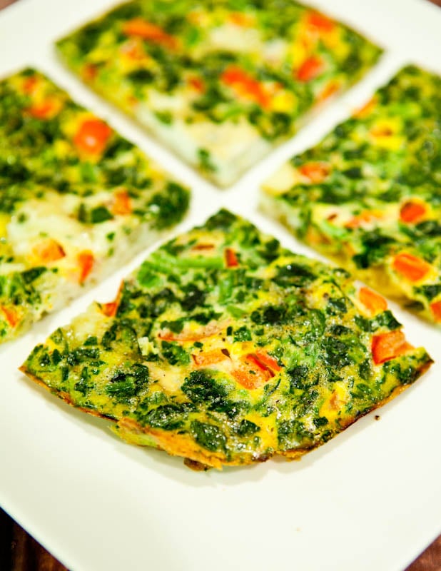 Spinach and Red Pepper Frittata cut in four
