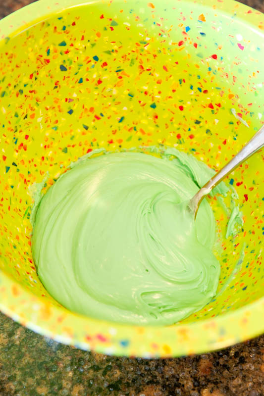 Green frosting in mixing bowl