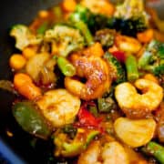 Stir-fried shrimp and mixed vegetables in a sauce.