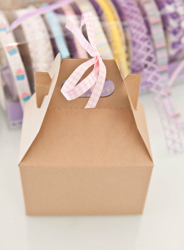 Brown box with pink ribbon