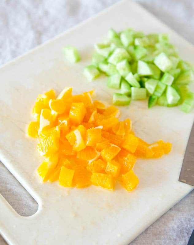 Sliced up oranges and cucumbers
