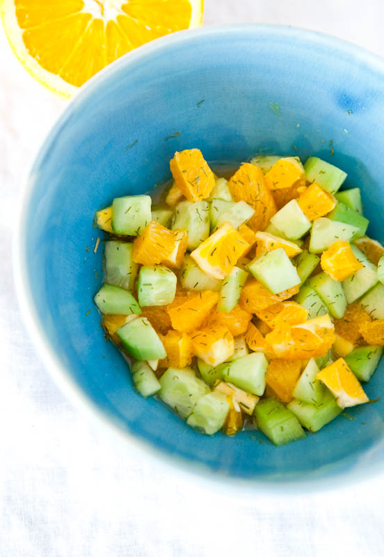 Cucumber and orange chopped up with dill