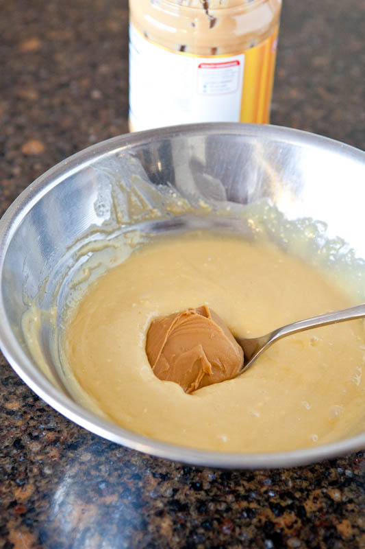 batter with spoon of peanut butter in it