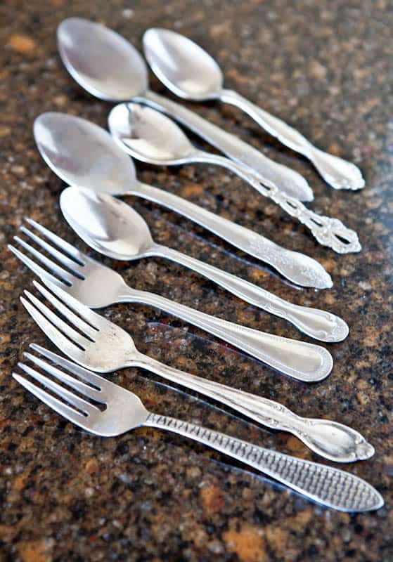 Forks and spoons with fancy designs on handle