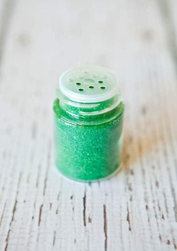Green sparkly sprinkles in bottle